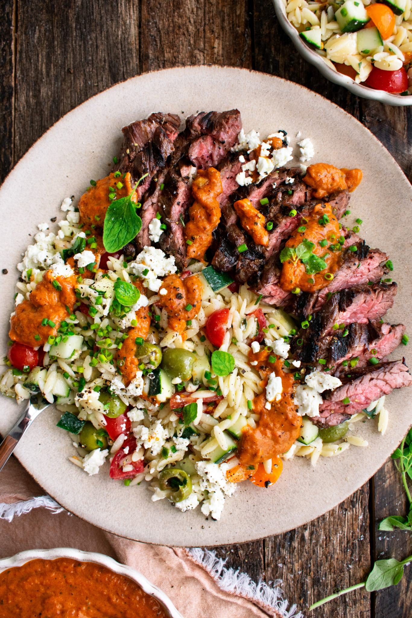 Grilled Garlic Steak with Orzo Salad & Red Pepper Sauce