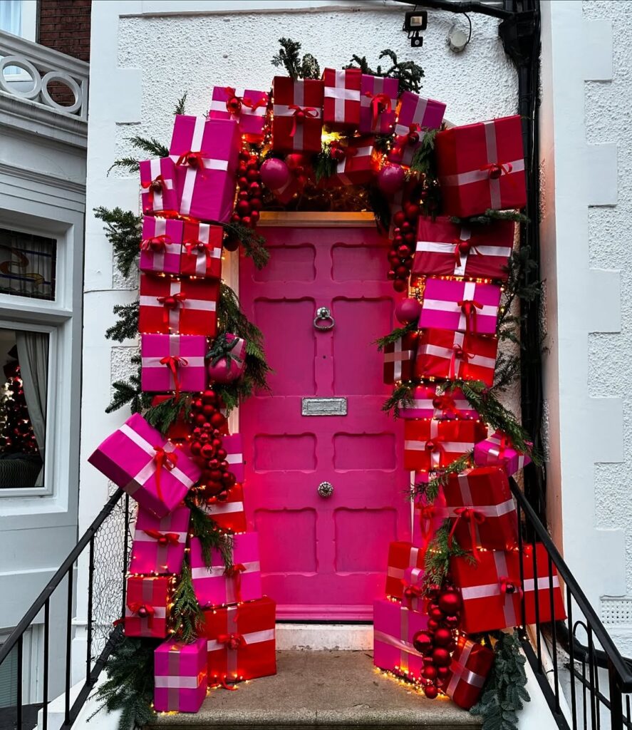 Christmas Porch With Red And Pink Presents 
